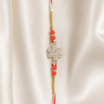 Vertical view of handcrafted Red Crystal Snowflake Rakhi for Raksha Bandhan