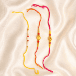 Eshanarya Designer Rakhi Combo featuring Pearl Rakhi, Traditional Gold Designer Rakhi and Pink Thread Designer Rakhi for Raksha Bandhan